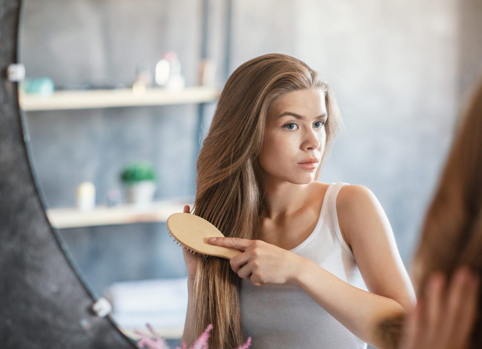 Bigstock Lovely Lady Brushing Her Long 386115631